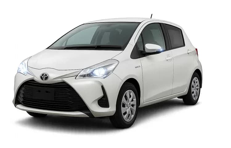 White Toyota Vitz Hybrid, a small hatchback